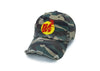 Damaged camo hat with gold and red logo.