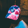 Tie Dye dad hat with blue and white logo.